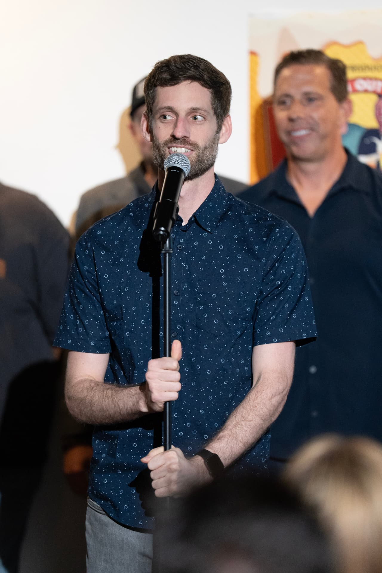 Performer at the mic stand during the show