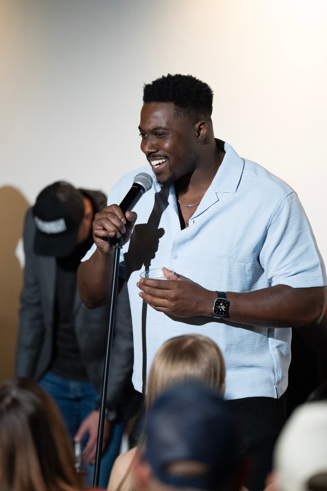 Comedian laughing with the crowd at Arizona After Dark